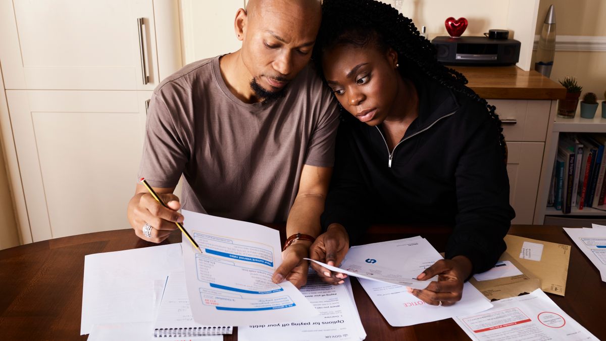 Parents reviewing long-term financial options for a child's future.